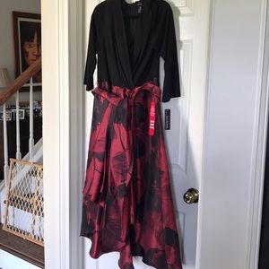 Black top, burgundy satin high-low skirt. Great party or wedding guest dress